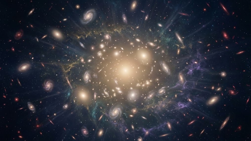 Countless galaxies, spirals and soft glowing ellipticals, spreading outward through deep space from a warm golden centre.