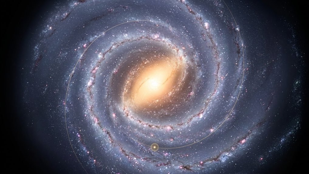 The Milky Way seen from far above, a bright spiral galaxy, with one small star marked partway out on an arm and a thin line tracing its long path around the centre.